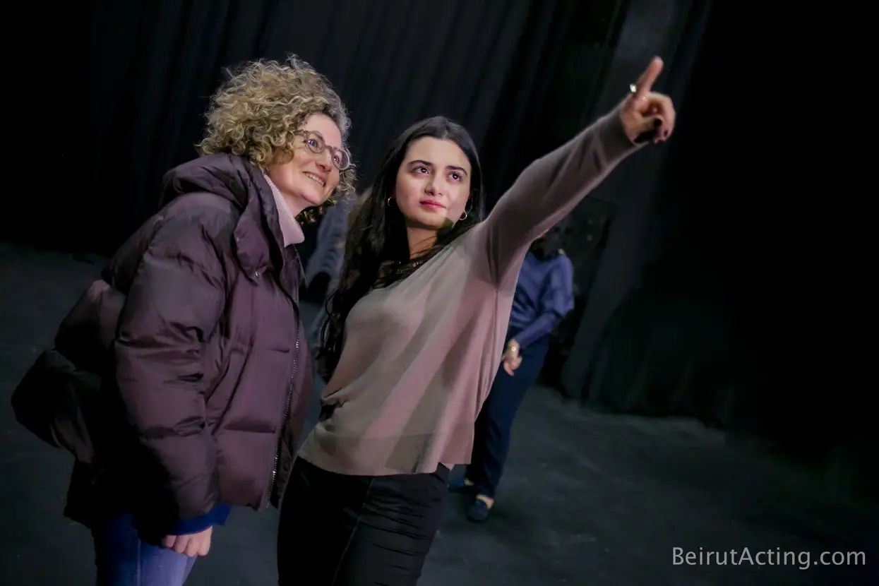 Tracy Greige and an instructor pointing during an acting workshop
