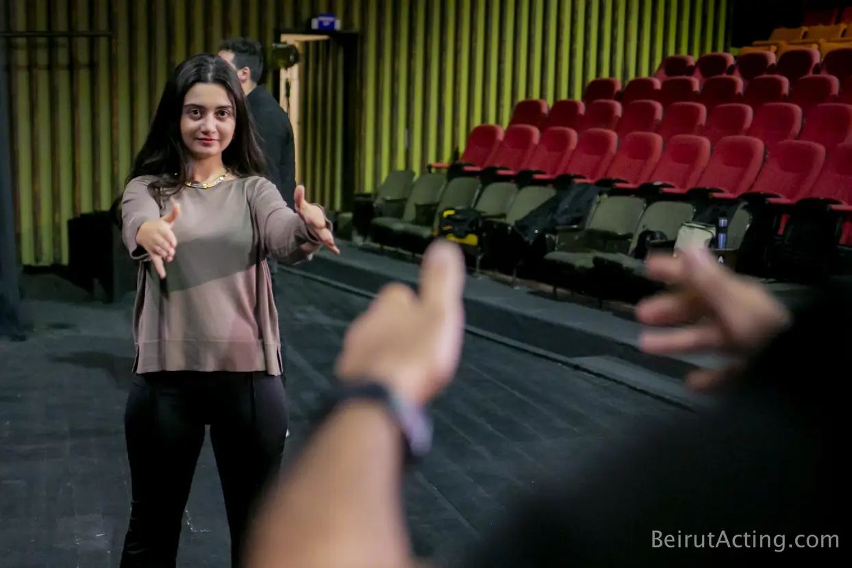 Tracy Greige participating in a movement exercise at Beirut Acting